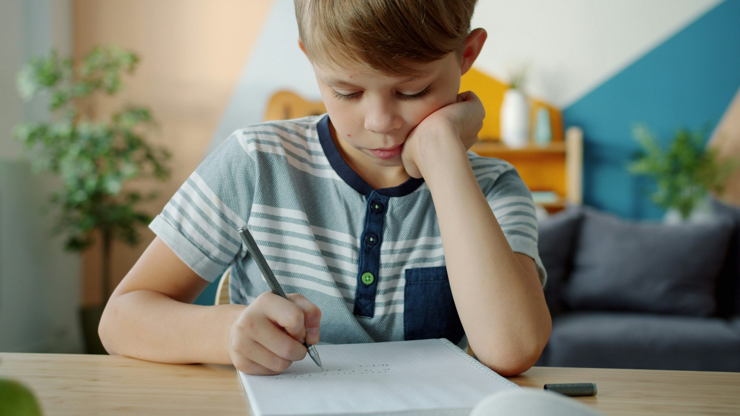 young boy working at a desk